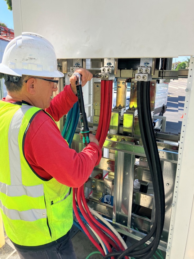 RESCOM electrician working on distribution equipment